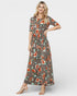 Woman wearing a floral dress on a white background