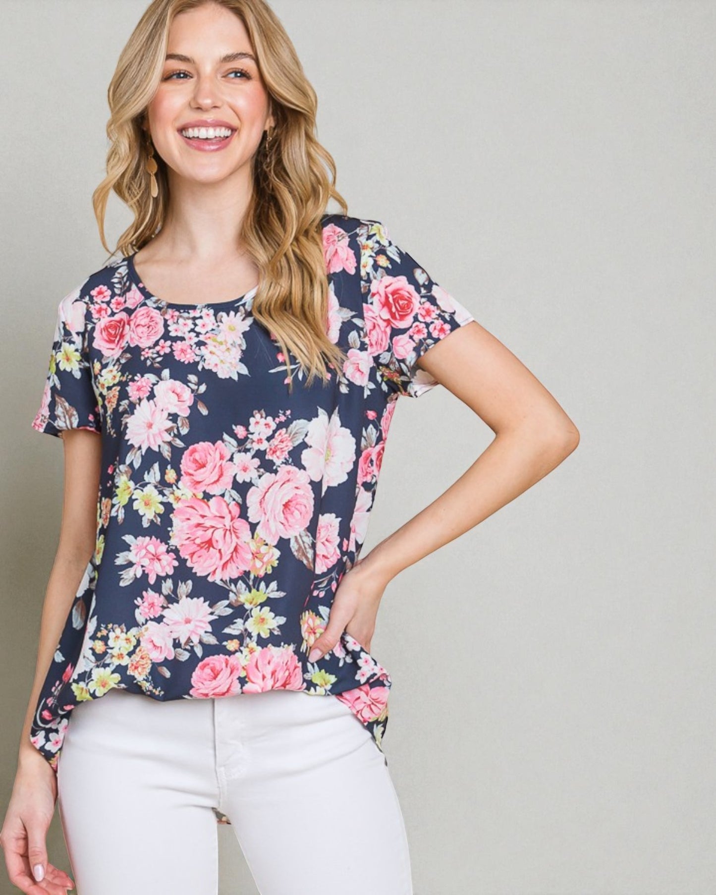 Woman wearing a floral blouse with a plain background
