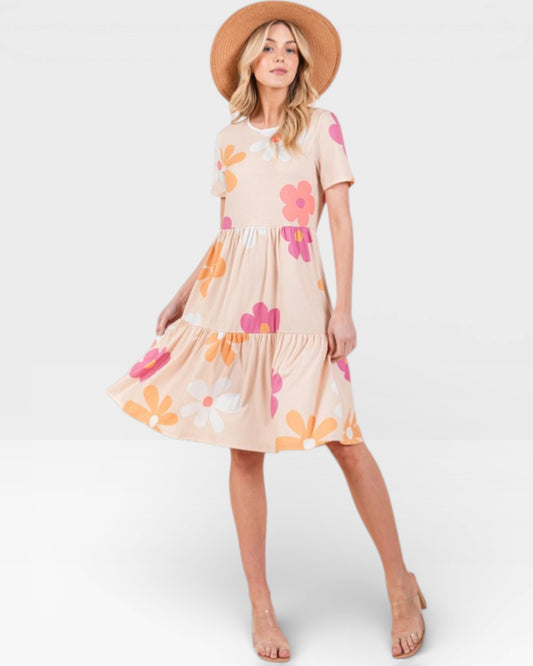 Woman wearing a floral dress with a white background