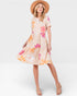 Woman wearing a floral dress with a white background