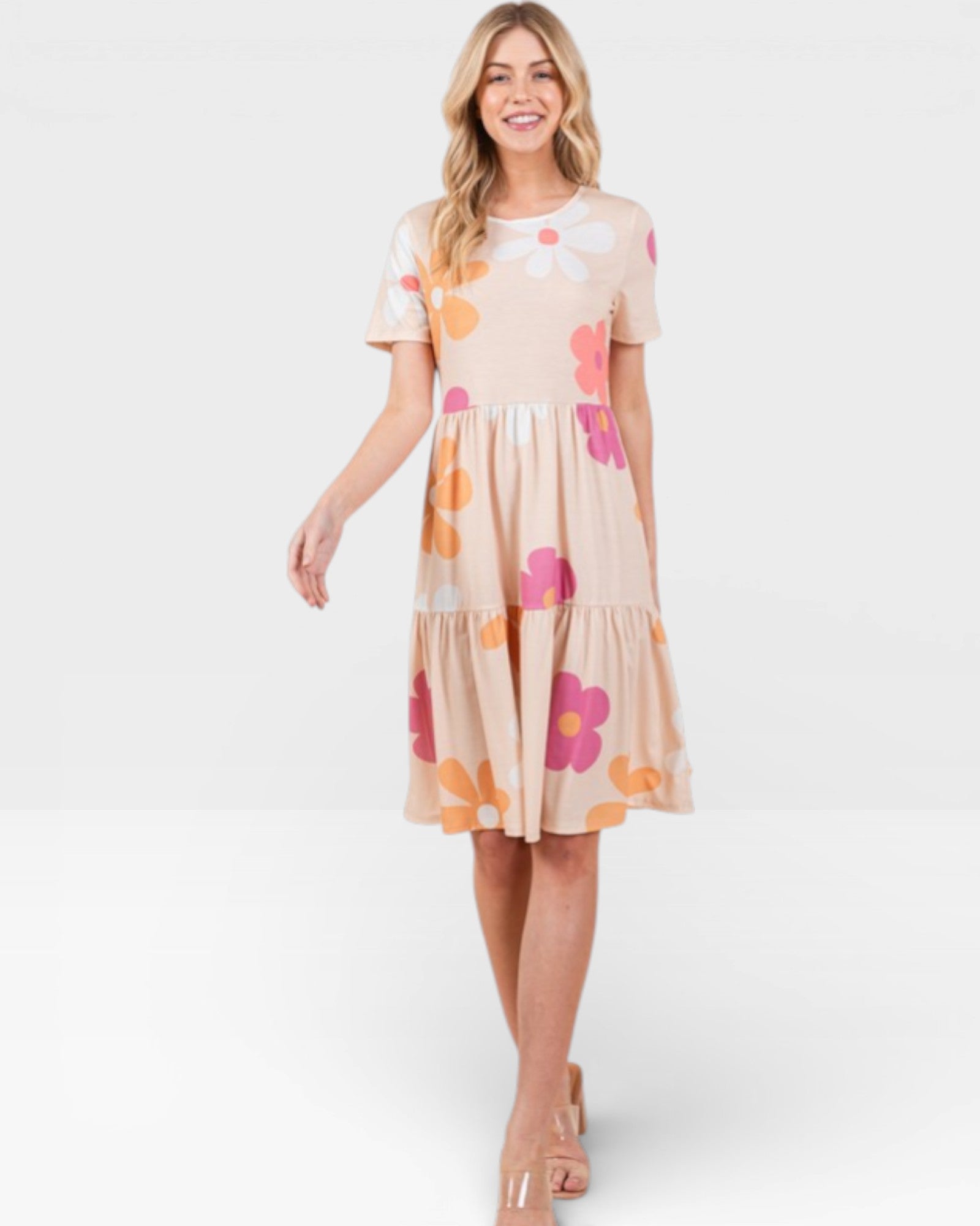 Woman wearing a floral dress on a white background