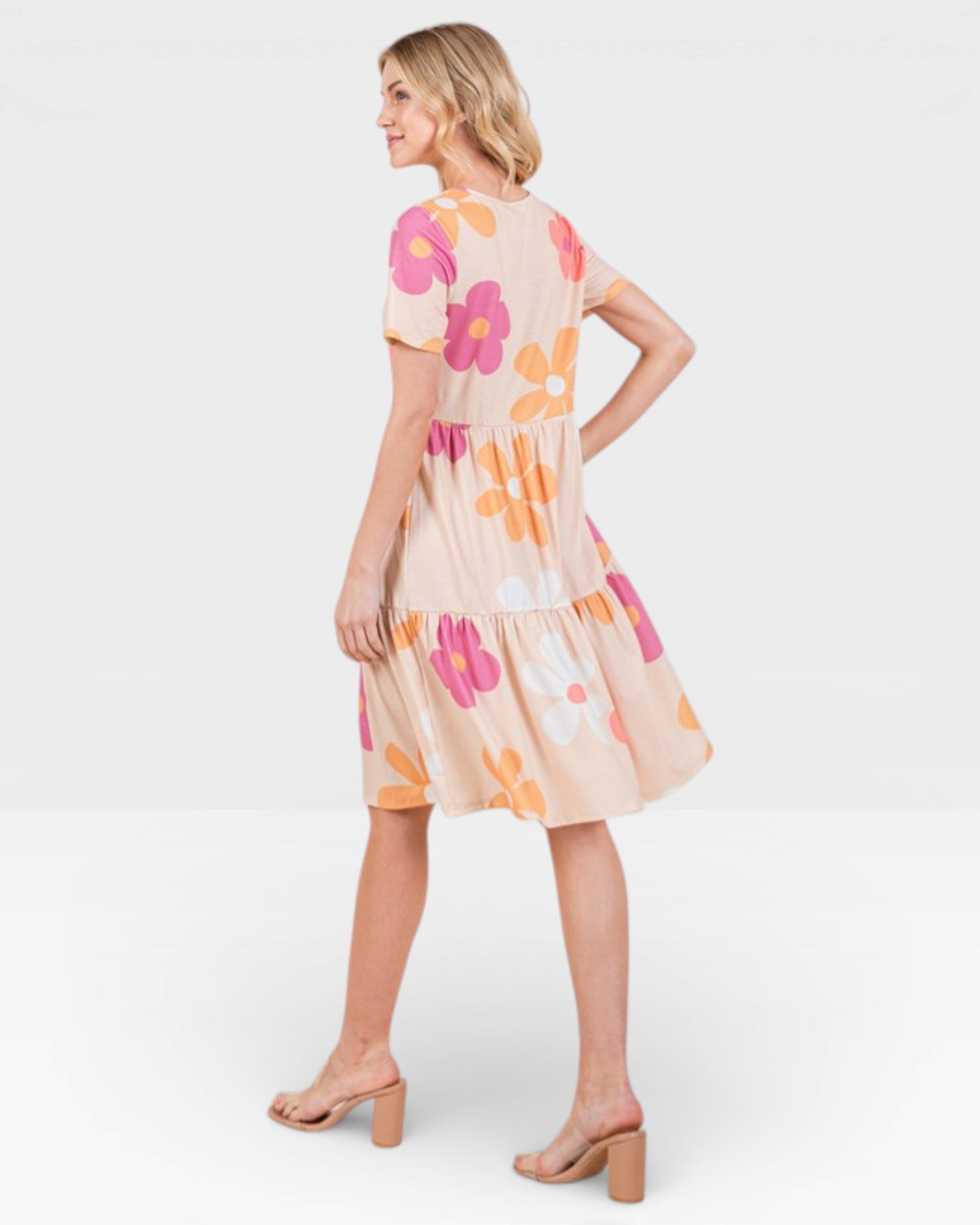 Woman wearing a floral dress on a white background