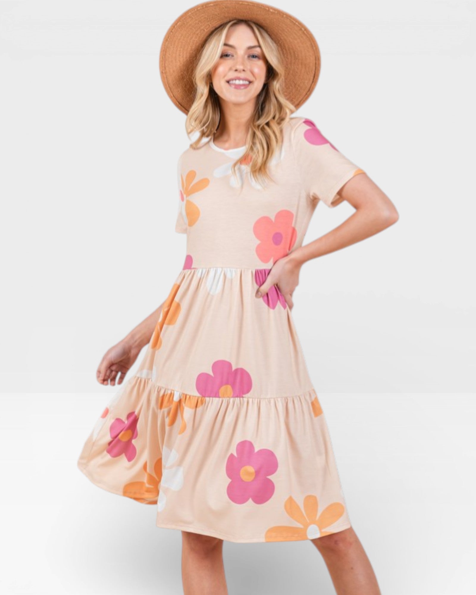 Woman wearing a floral dress with a white background