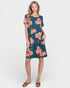 Woman wearing a floral dress on a white background