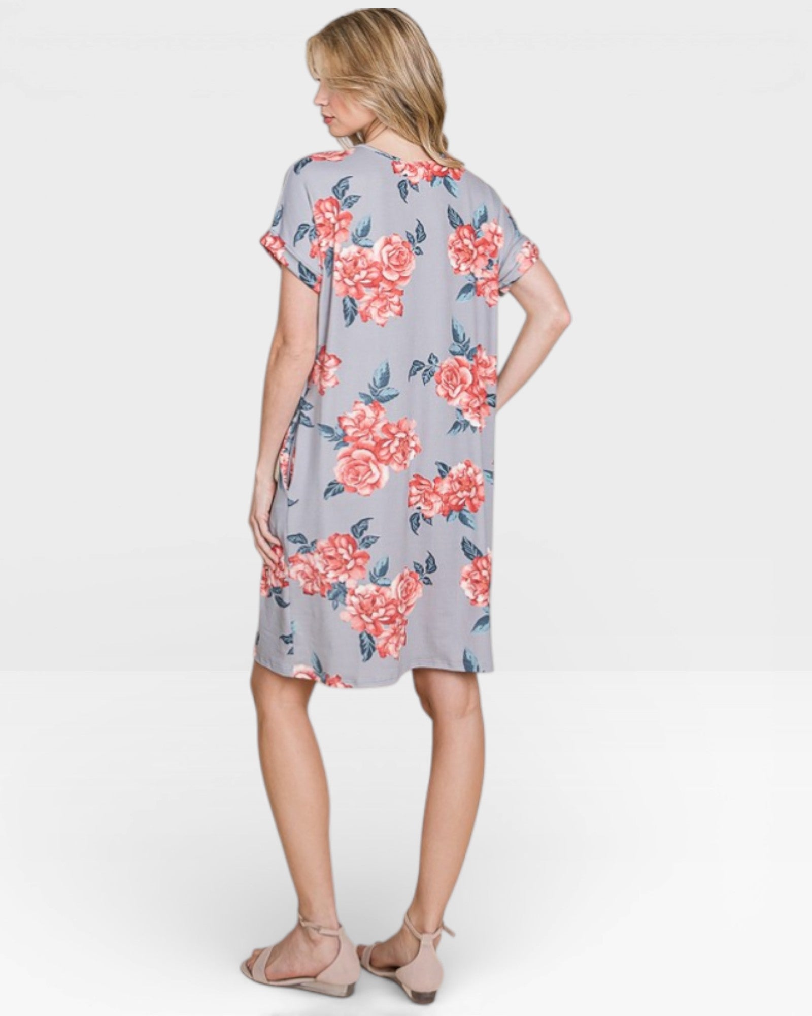 Woman wearing a floral dress on a white background