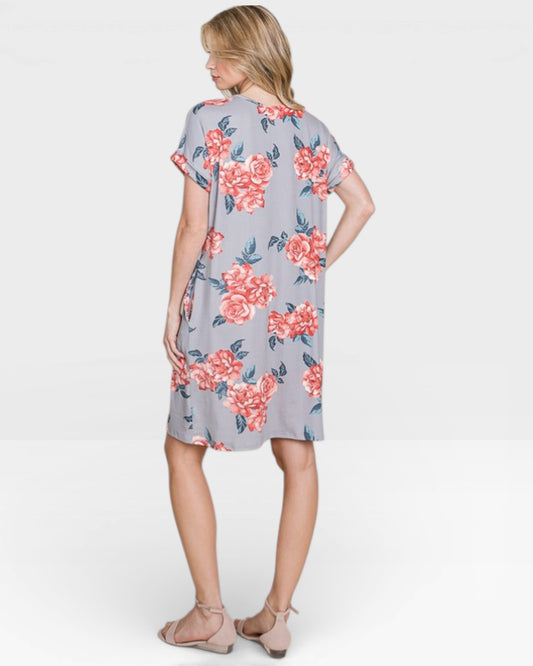 Woman wearing a floral dress on a white background