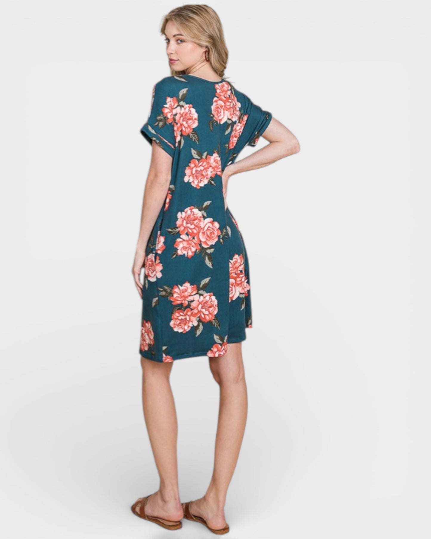 Woman wearing a floral dress on a white background