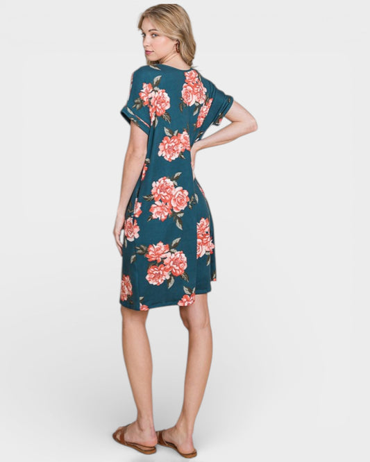 Woman wearing a floral dress on a white background