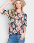 Camiseta de cuello redondo con estampado floral en azul marino