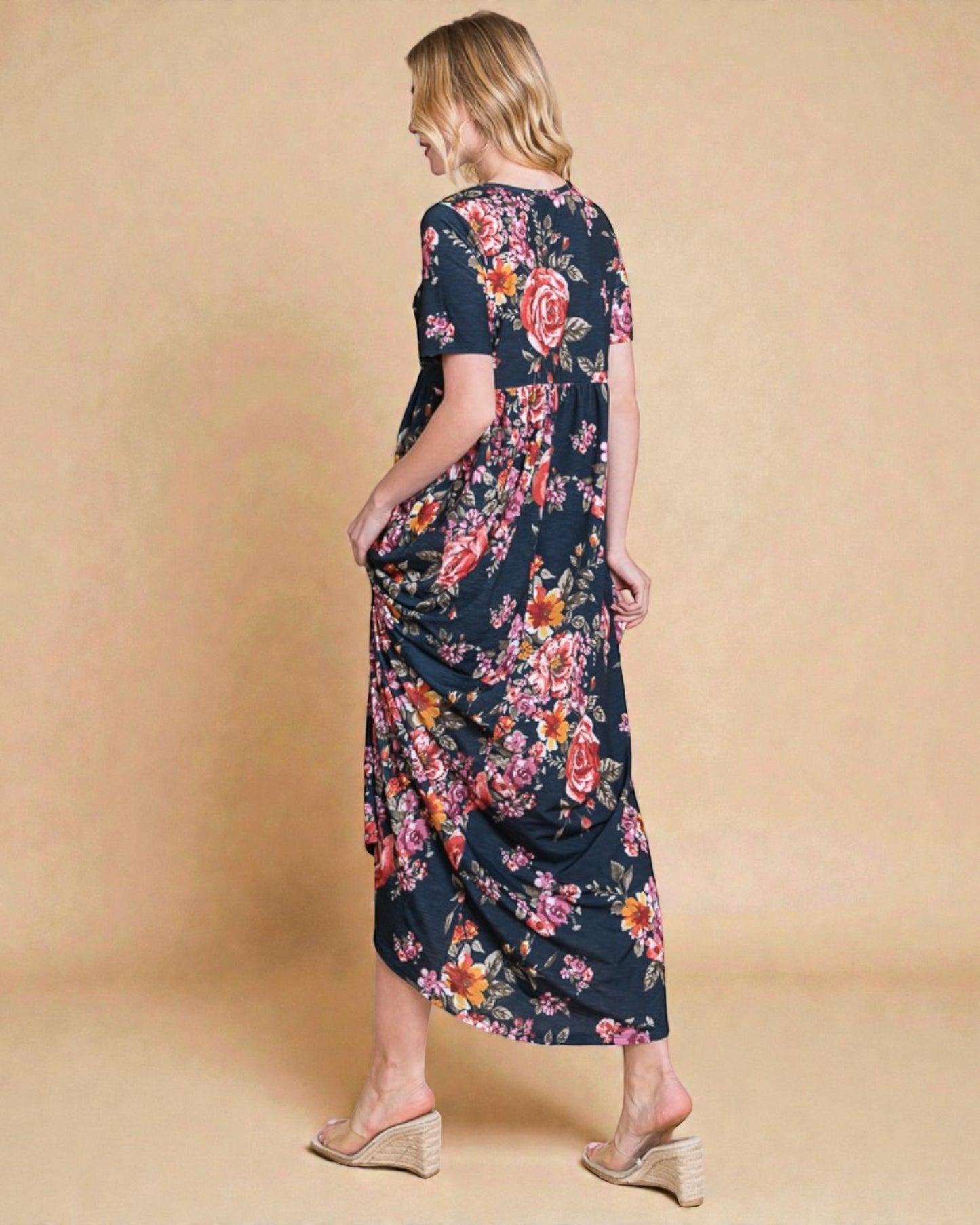 Woman wearing a floral dress on a beige background