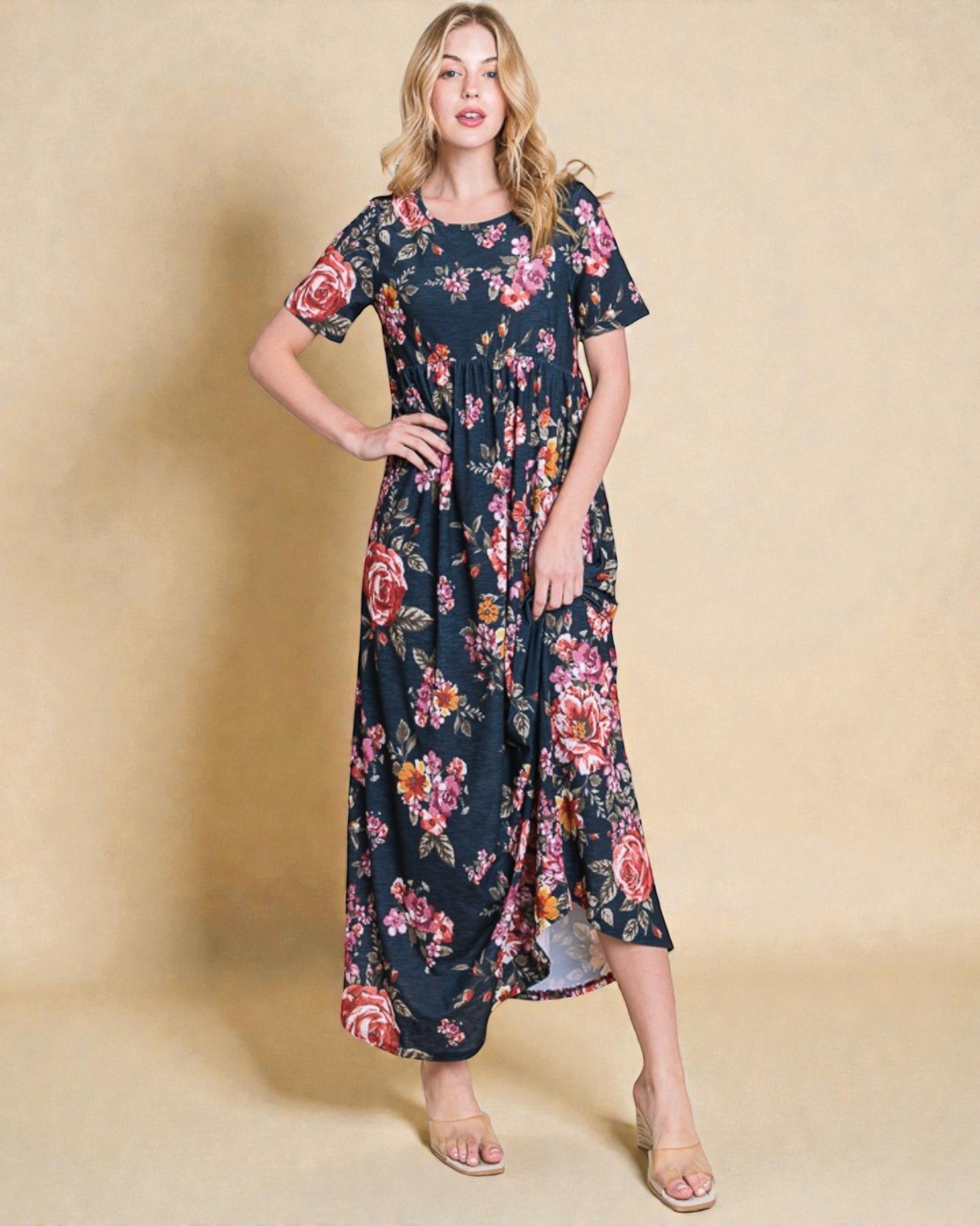 Woman wearing a floral dress against a beige background