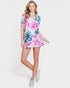 Woman wearing a floral dress on a white background