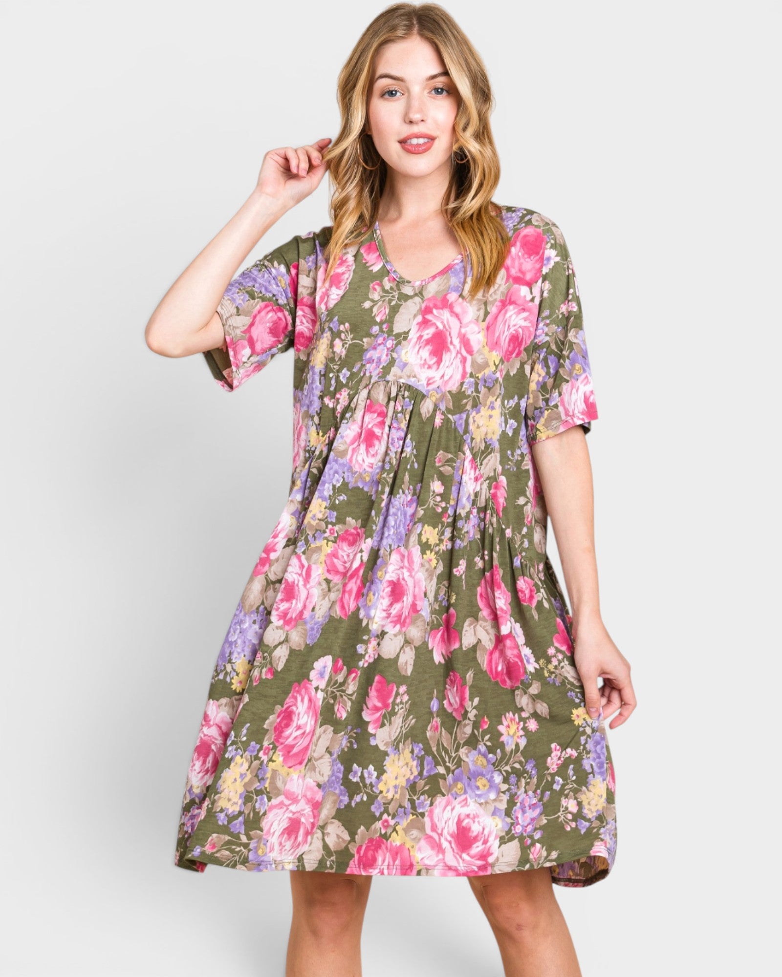 Woman wearing a floral dress on a white background