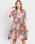 Woman wearing a floral dress on a white background