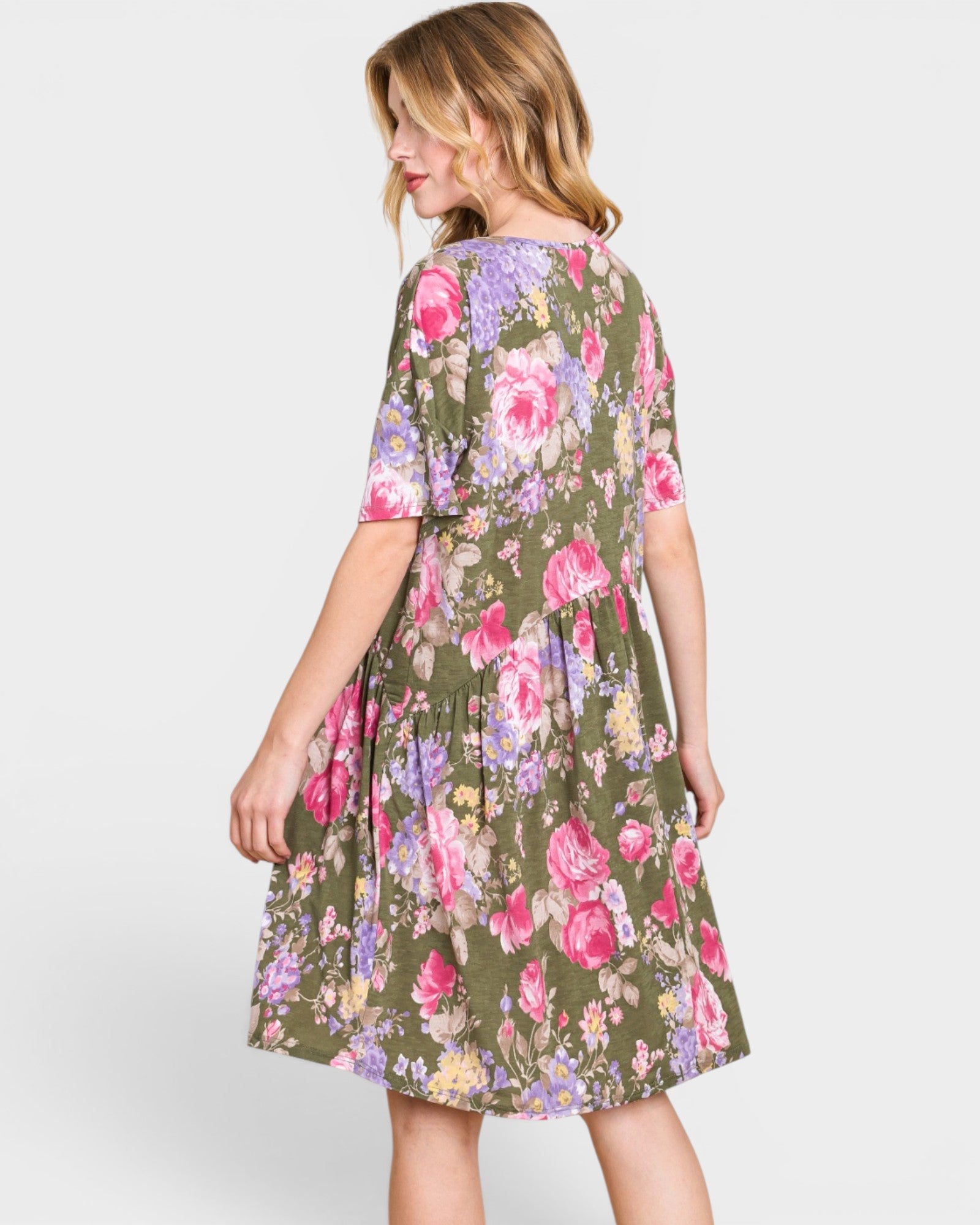 Woman wearing a floral dress on a white background