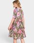 Woman wearing a floral dress on a white background