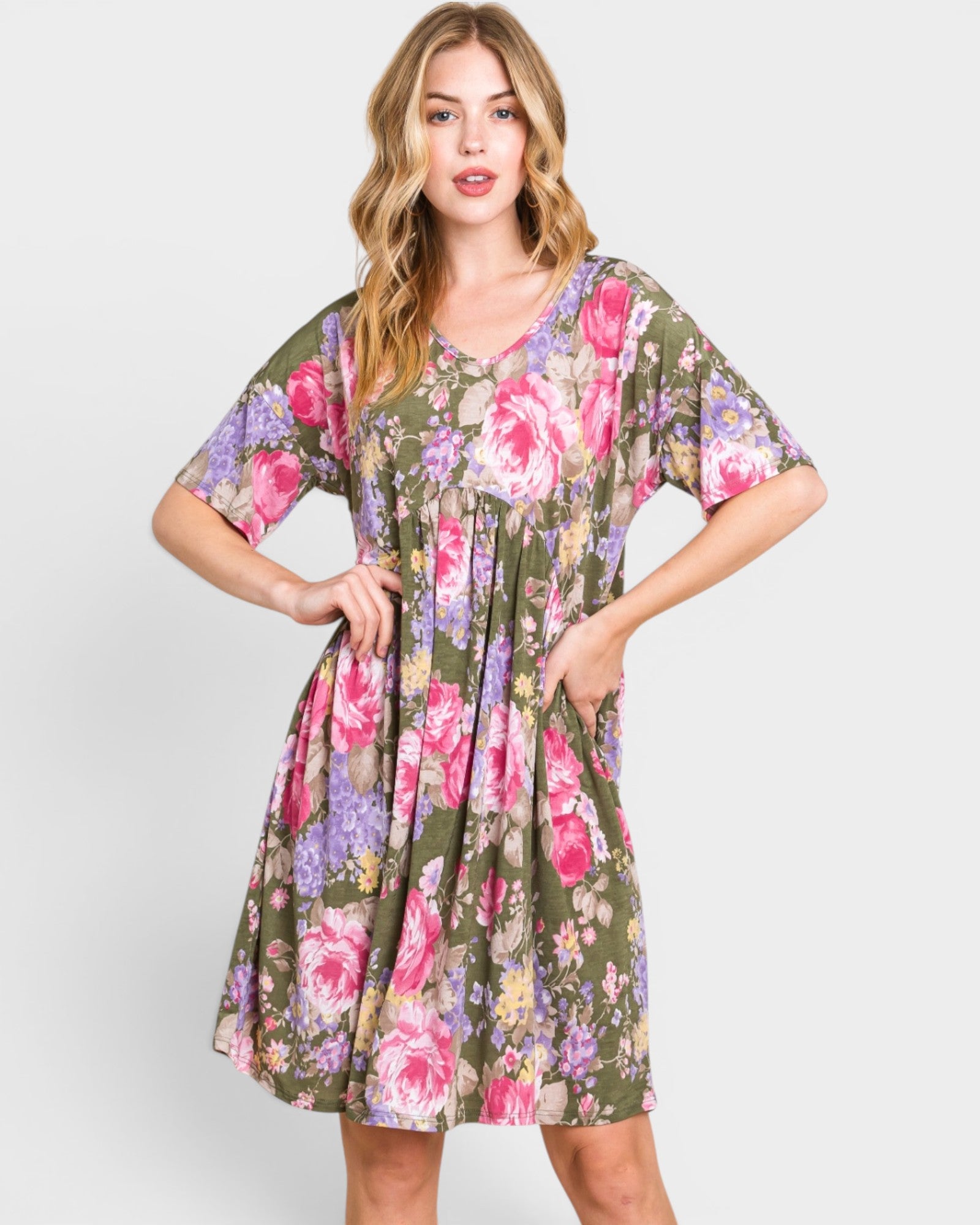 Woman wearing a floral dress on a white background