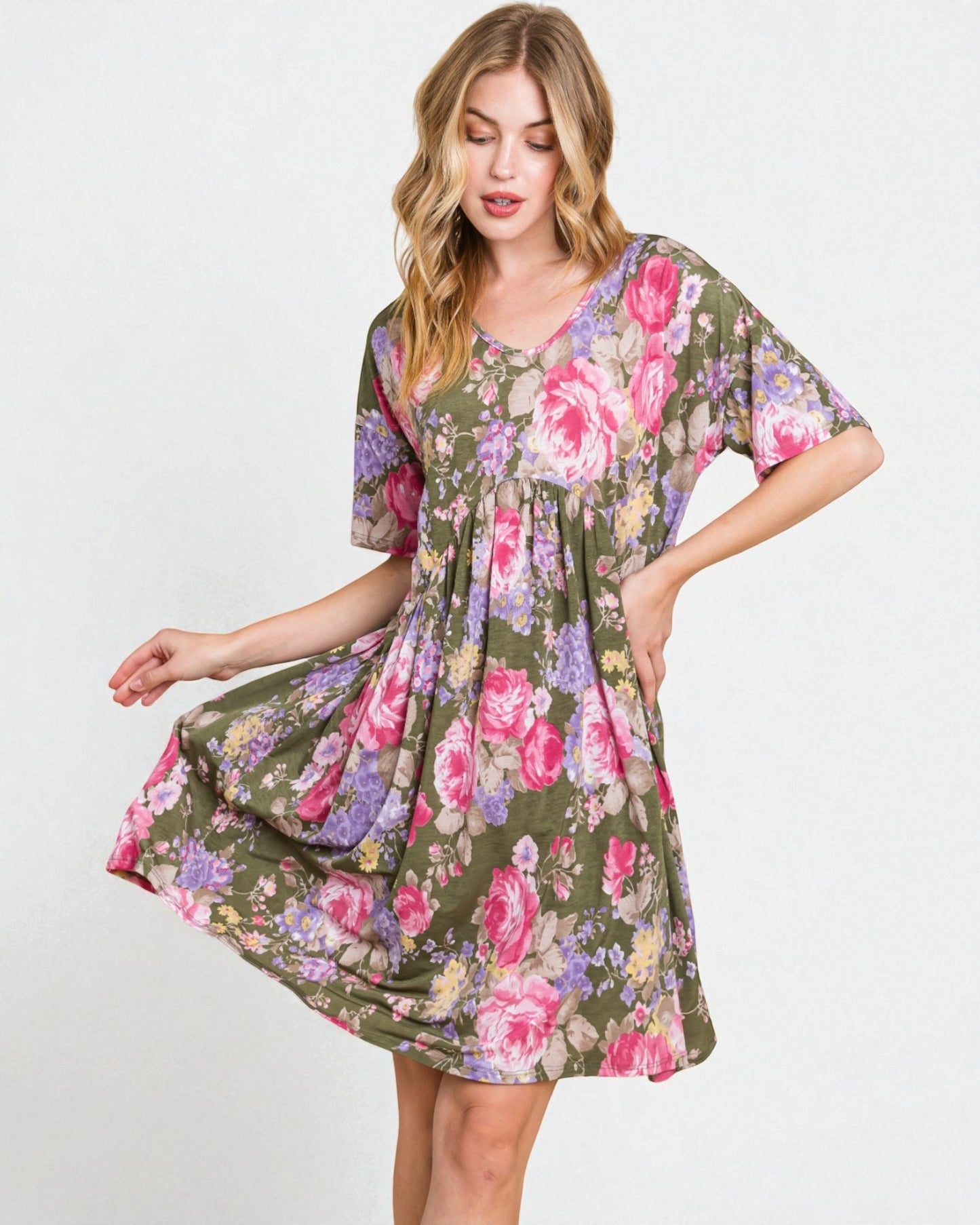 Woman wearing a floral dress on a white background