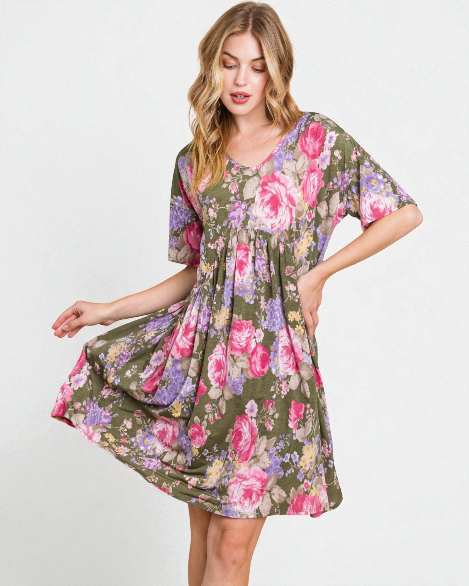 Woman wearing a floral dress on a white background