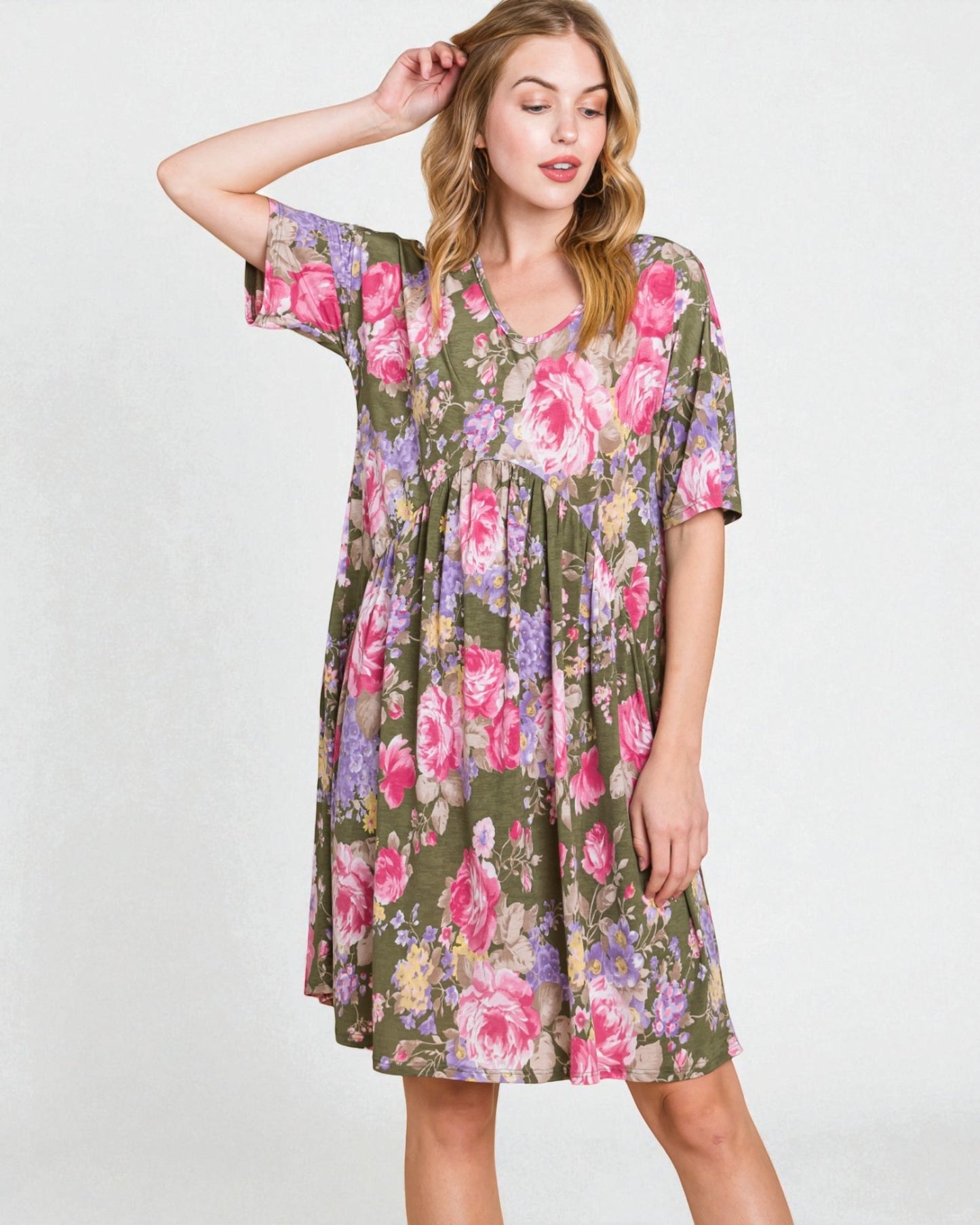 Woman wearing a floral dress on a white background