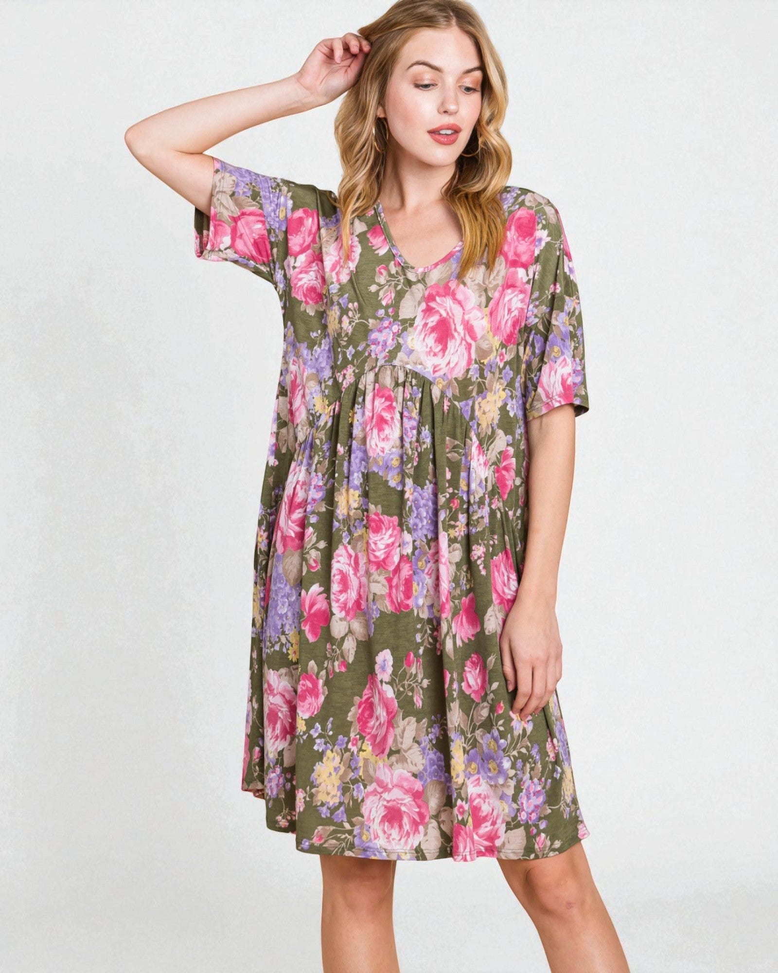 Woman wearing a floral dress on a white background