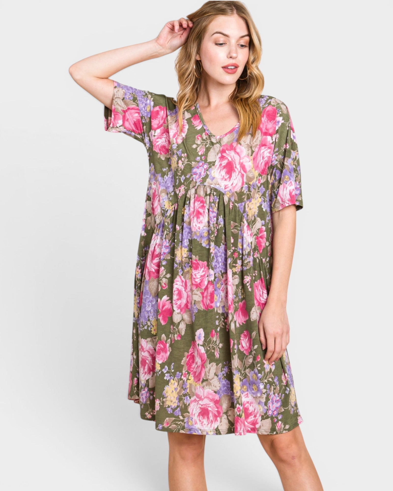 Woman wearing a floral dress on a white background