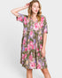 Woman wearing a floral dress on a white background