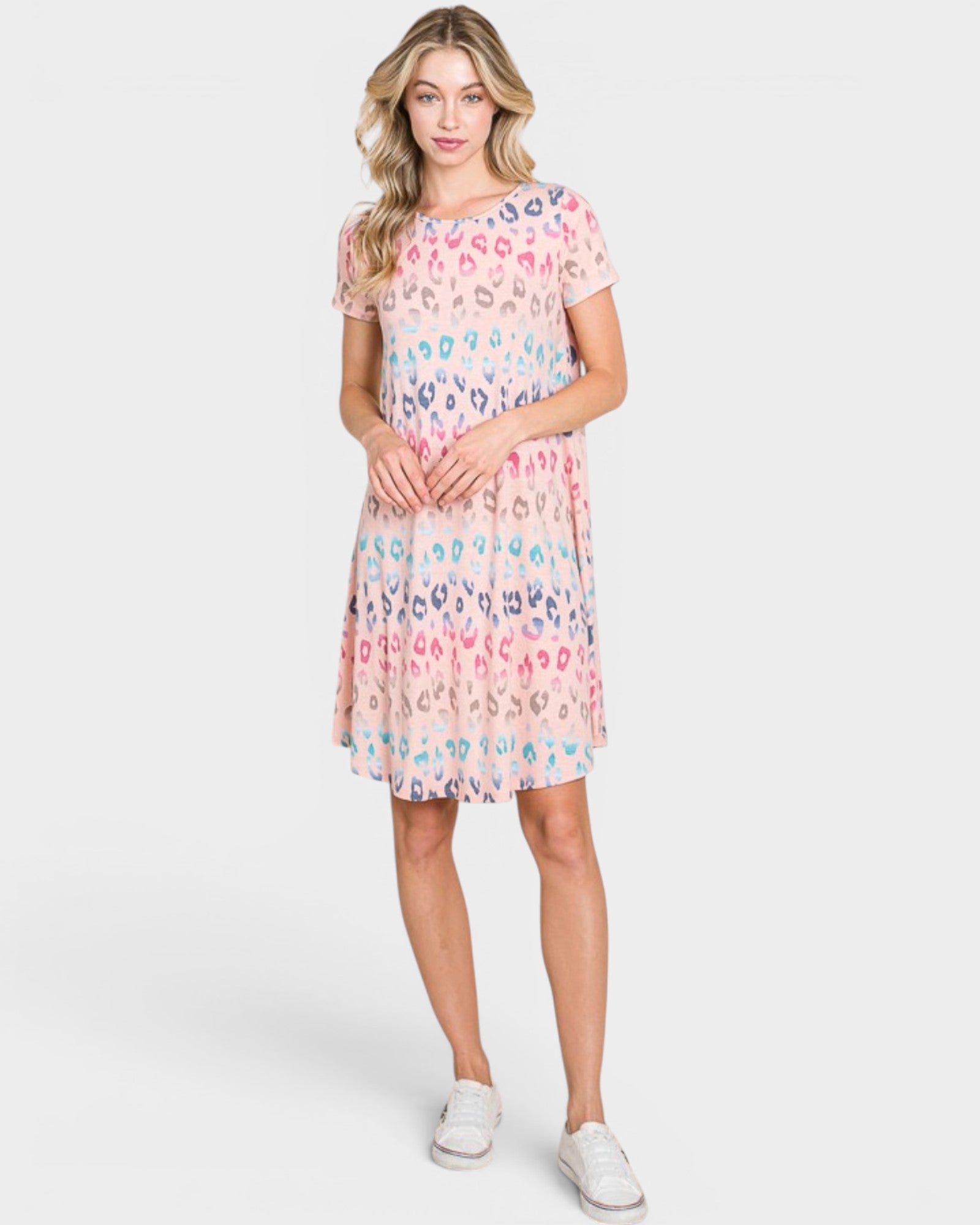 Woman wearing a patterned dress on a white background