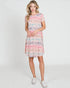 Woman wearing a floral dress on a white background