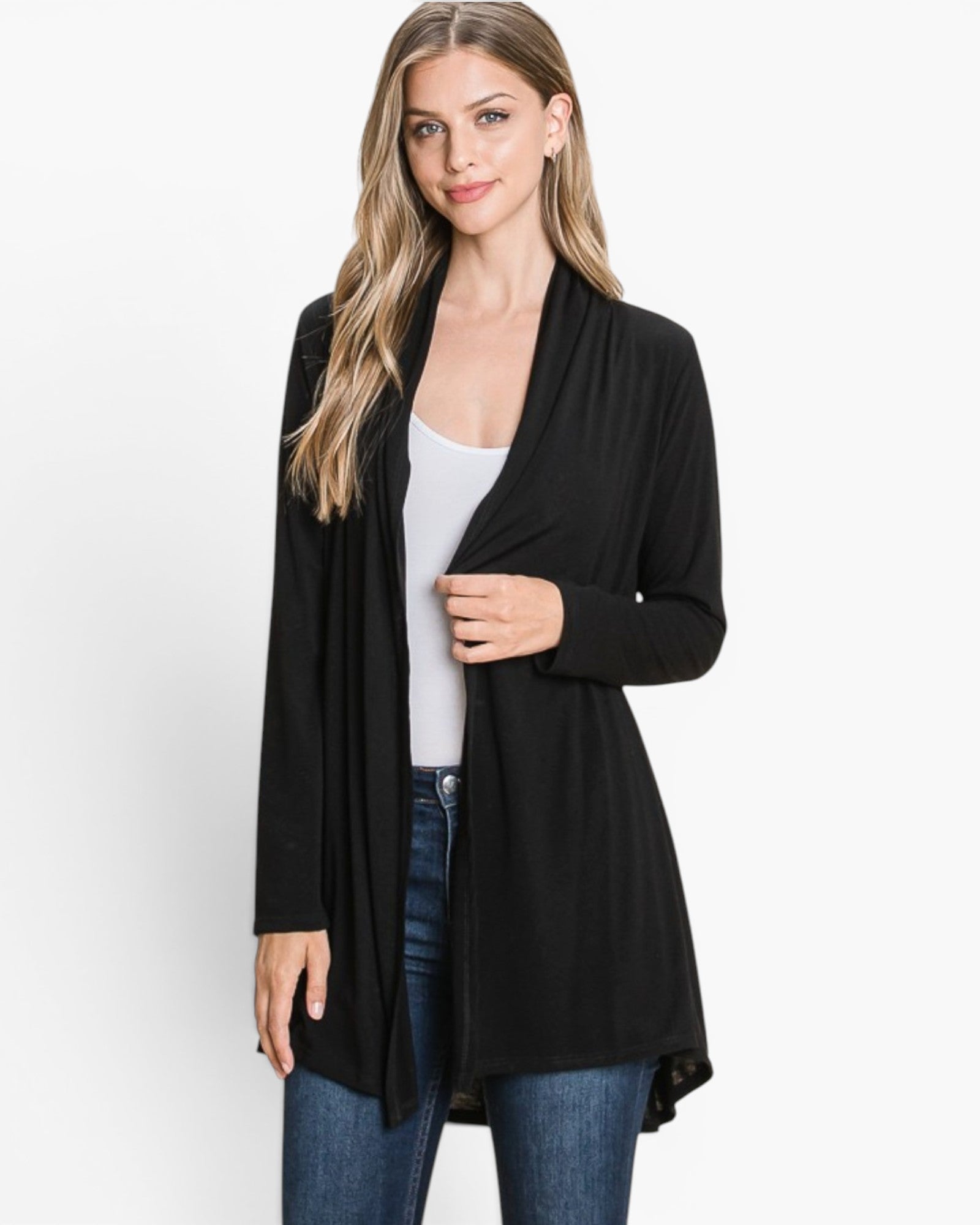 A woman modeling a black open-front long-sleeve cardigan over a white tank top and blue jeans, photographed against a clean white studio background.