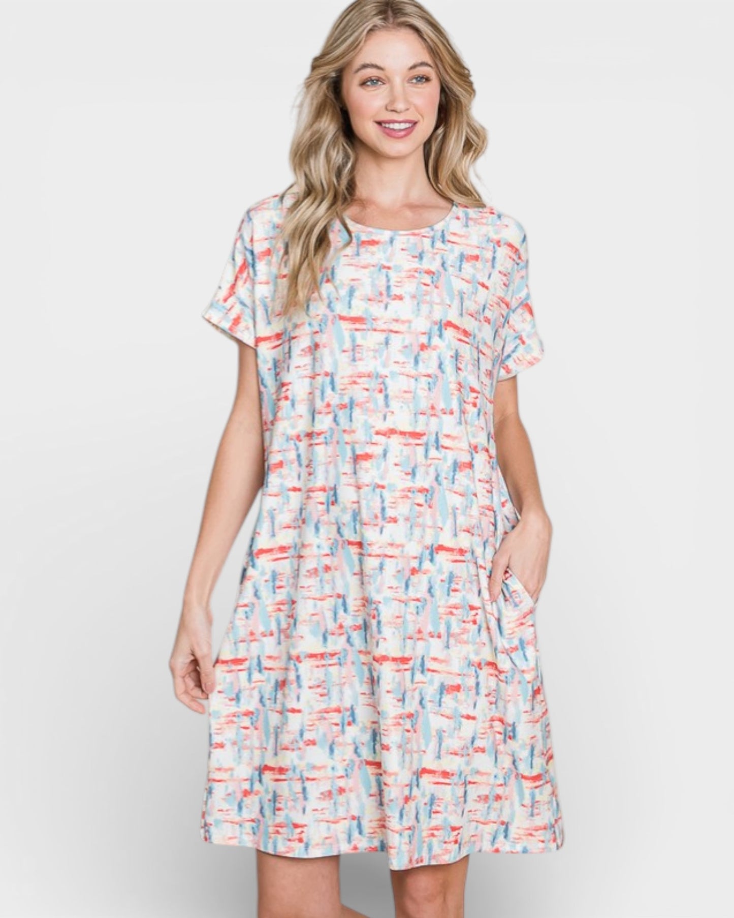 Woman wearing a patterned dress on a white background