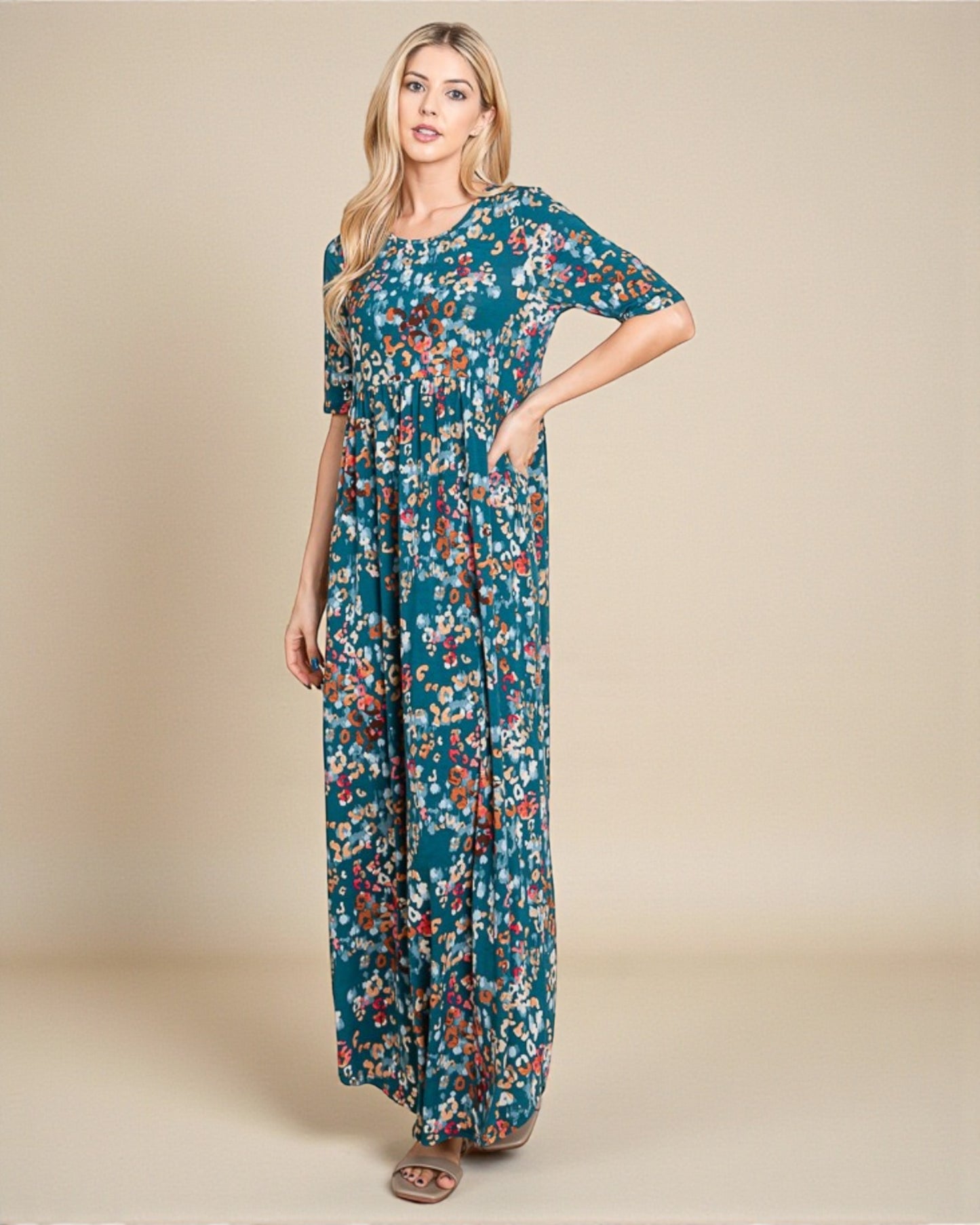 Woman wearing a floral dress on a beige background