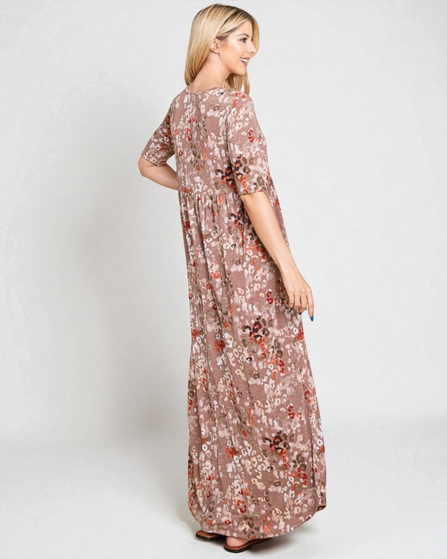 Woman wearing a floral dress on a white background