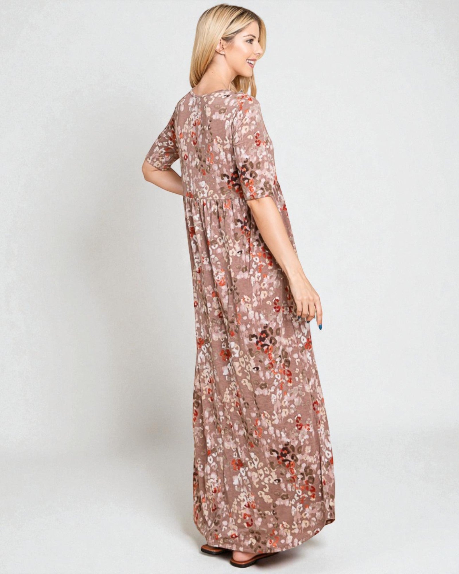 Woman wearing a floral dress on a white background