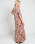 Woman wearing a floral dress on a white background
