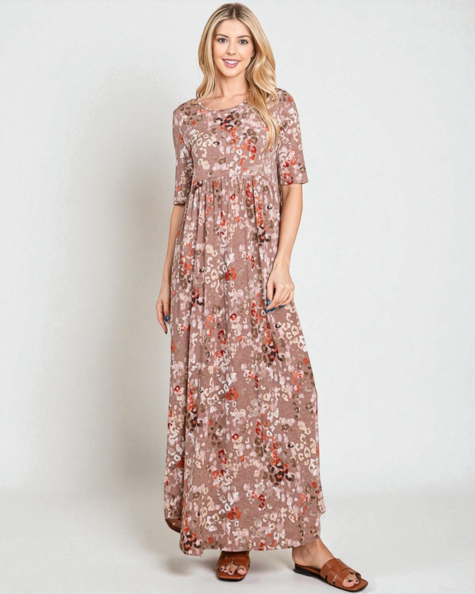 Woman wearing a floral dress on a white background