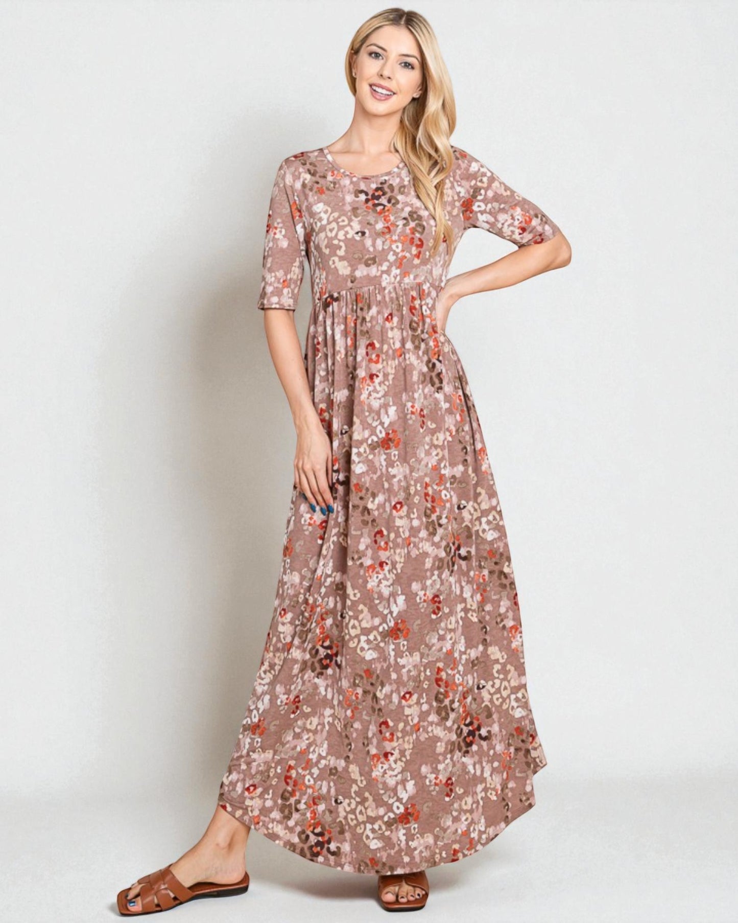 Woman wearing a floral dress on a white background