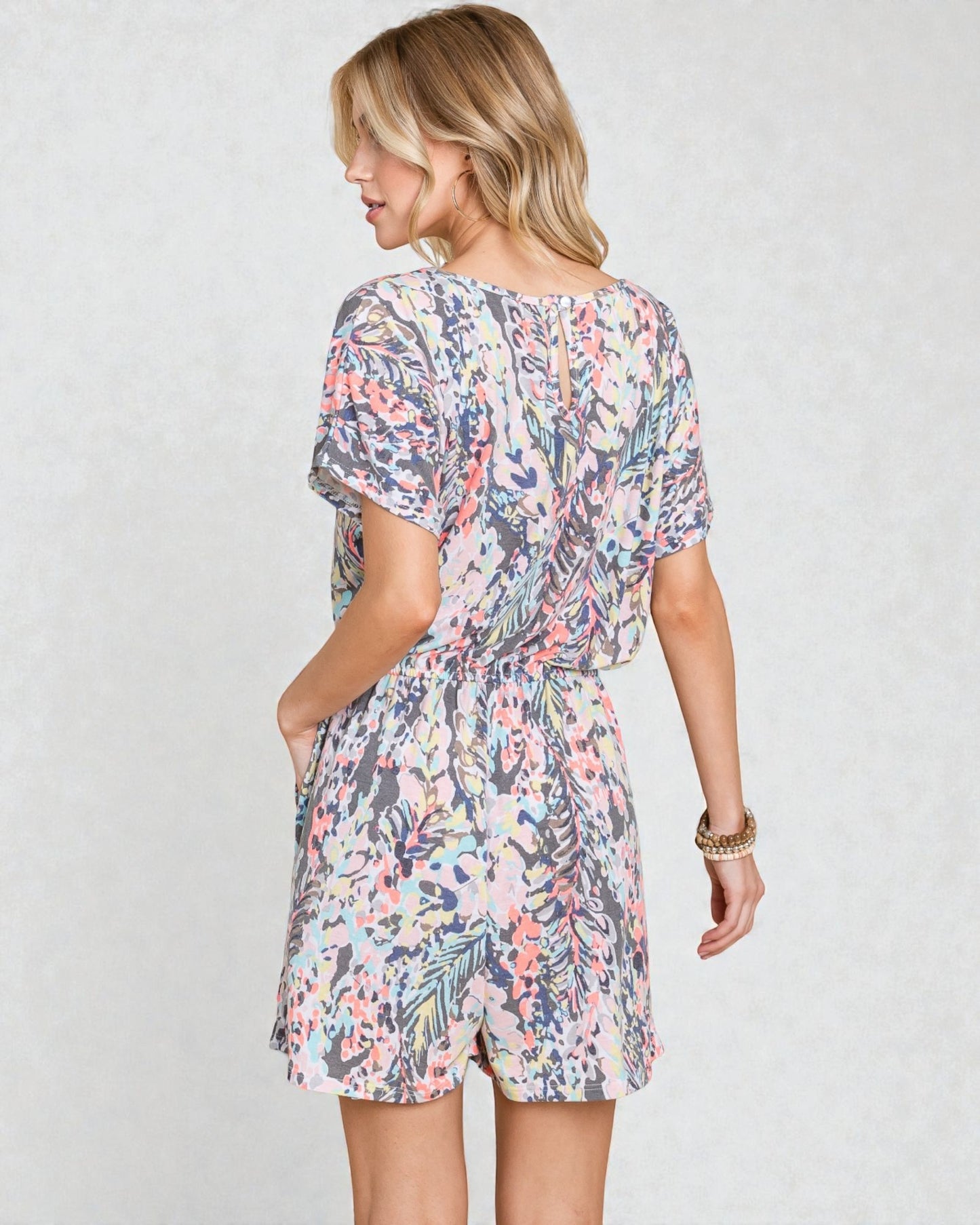 Woman wearing a floral dress on a white background