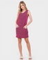 Woman wearing a pink sleeveless dress on a white background