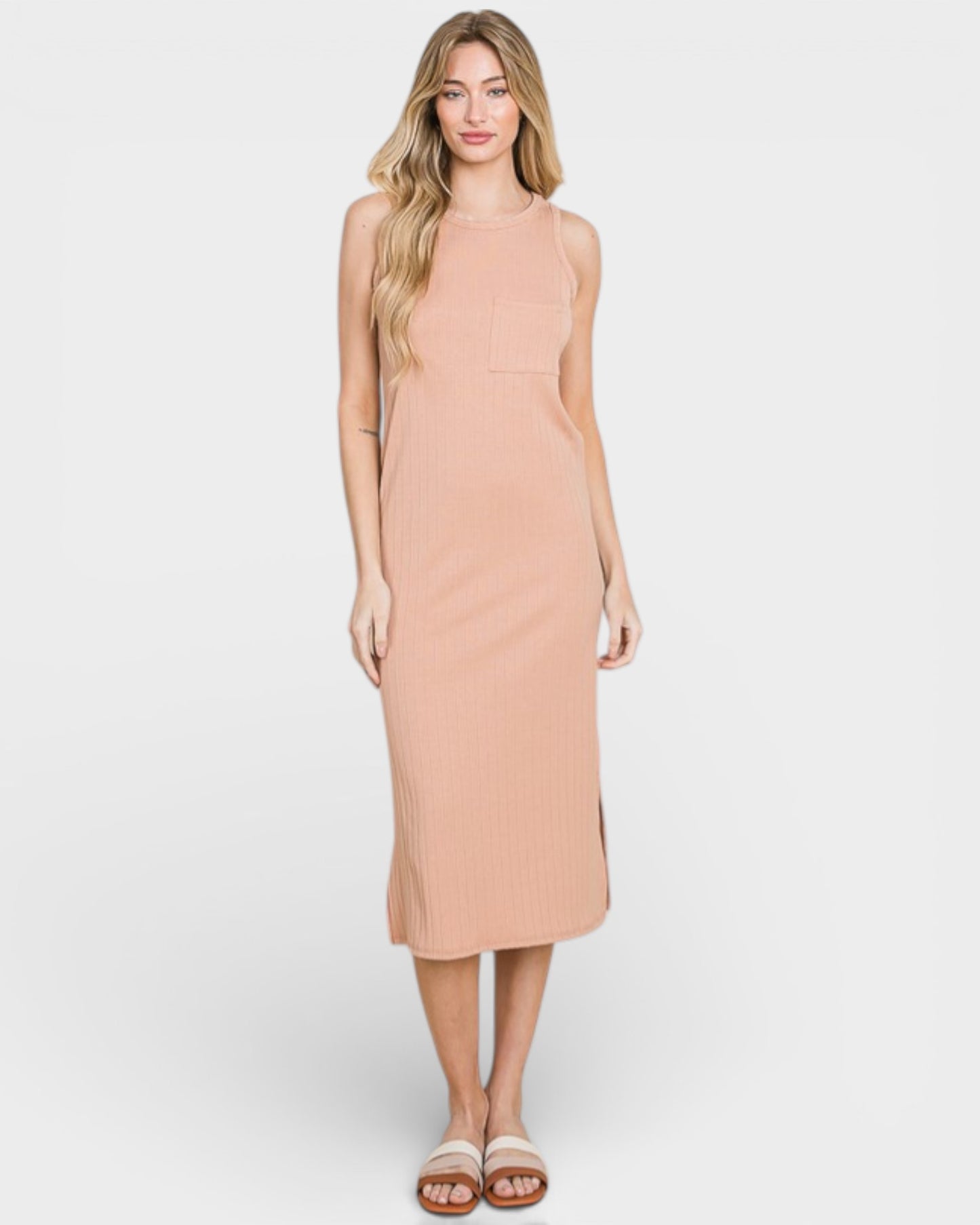 Woman wearing a beige sleeveless dress on a white background