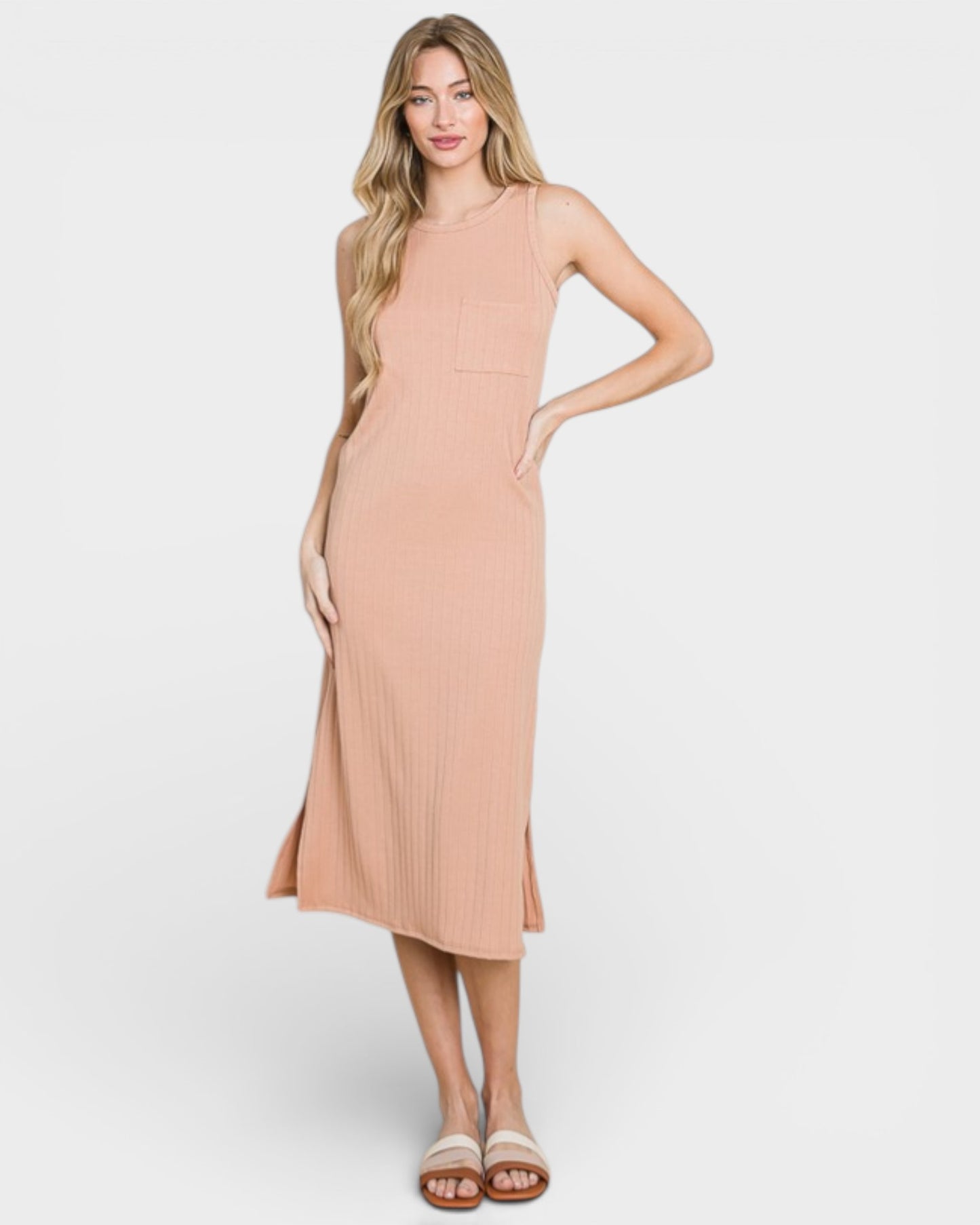 Woman wearing a beige dress on a white background