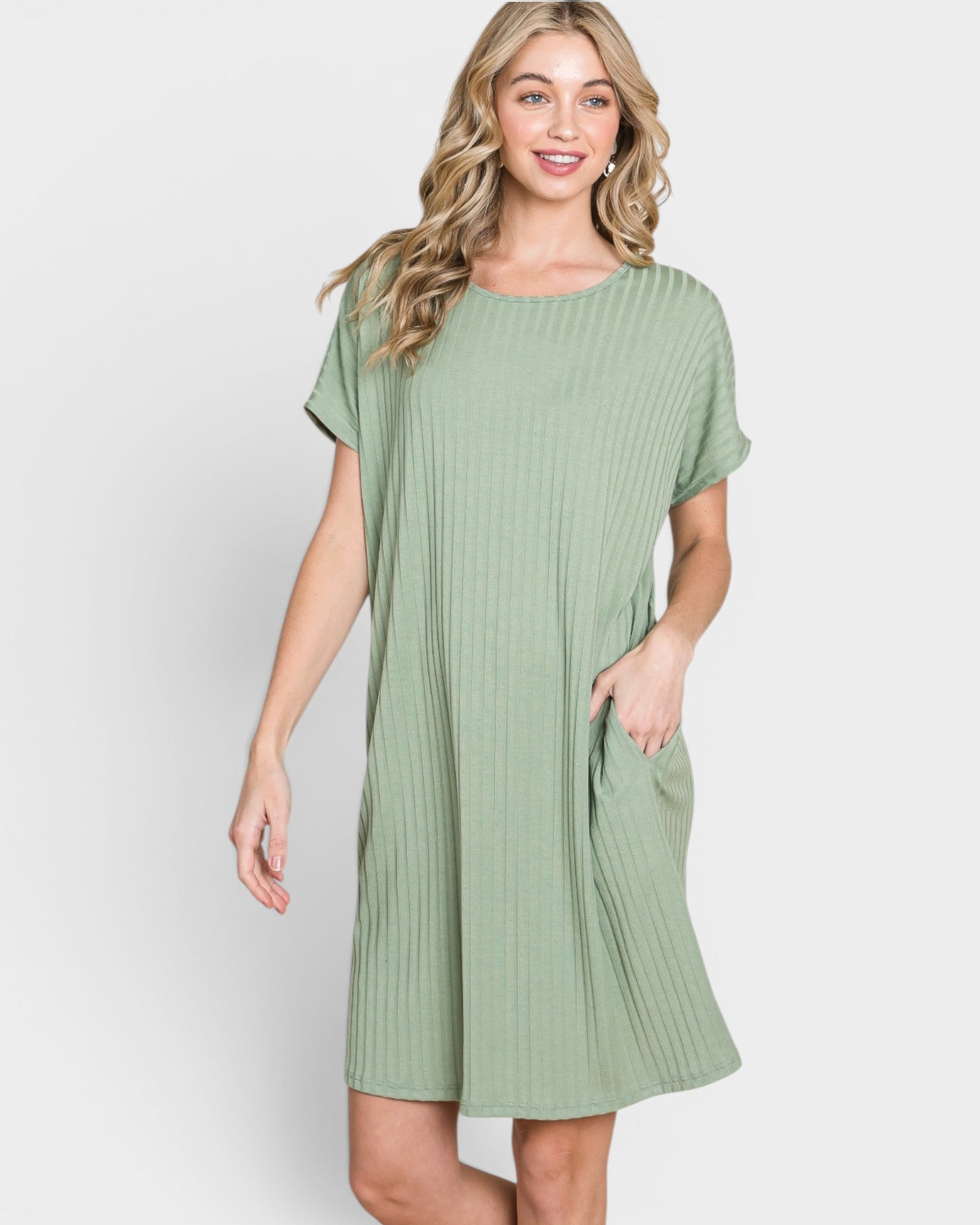 Woman wearing a green dress on a white background