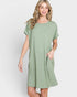 Woman wearing a green dress on a white background