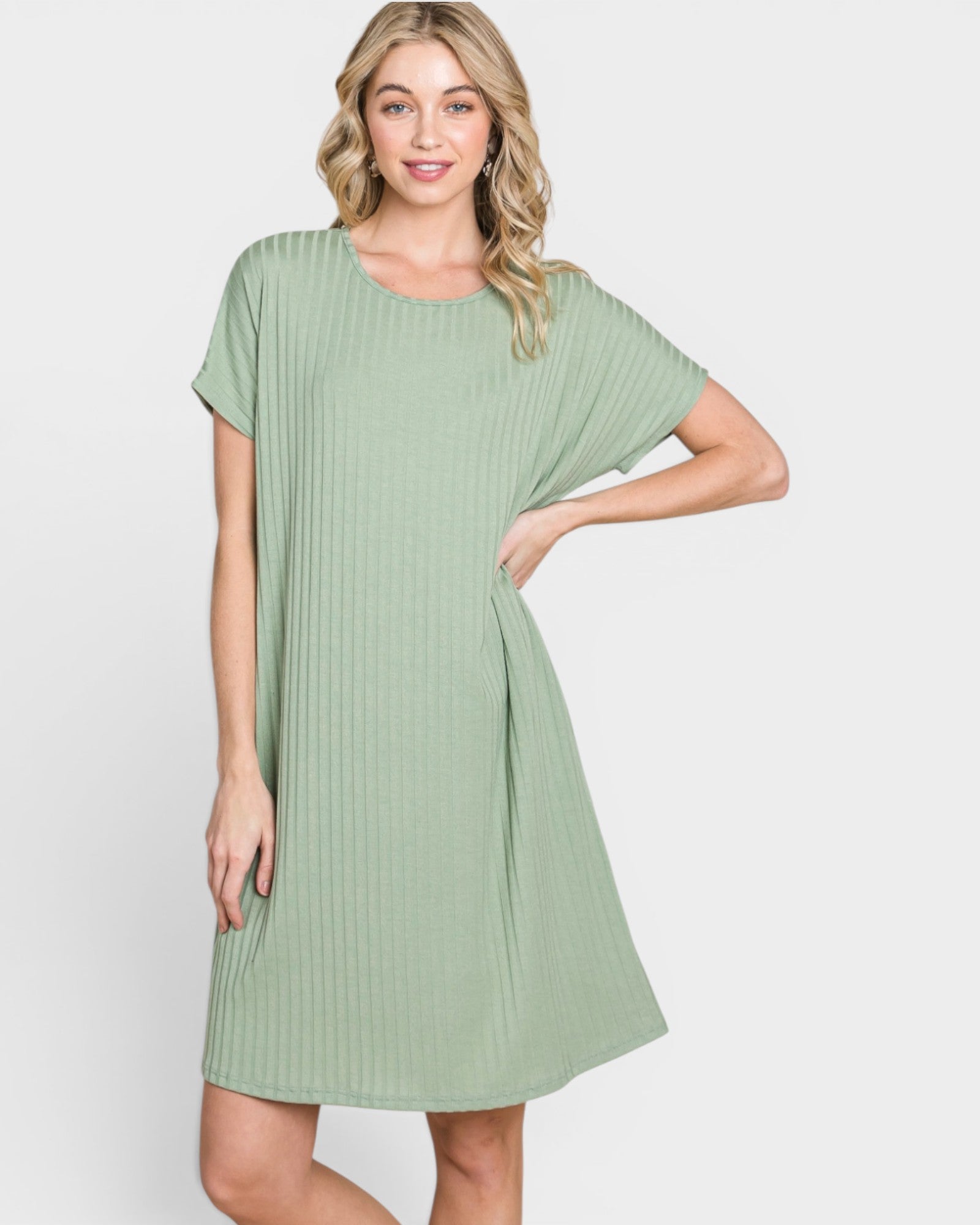 Woman wearing a green dress on a white background