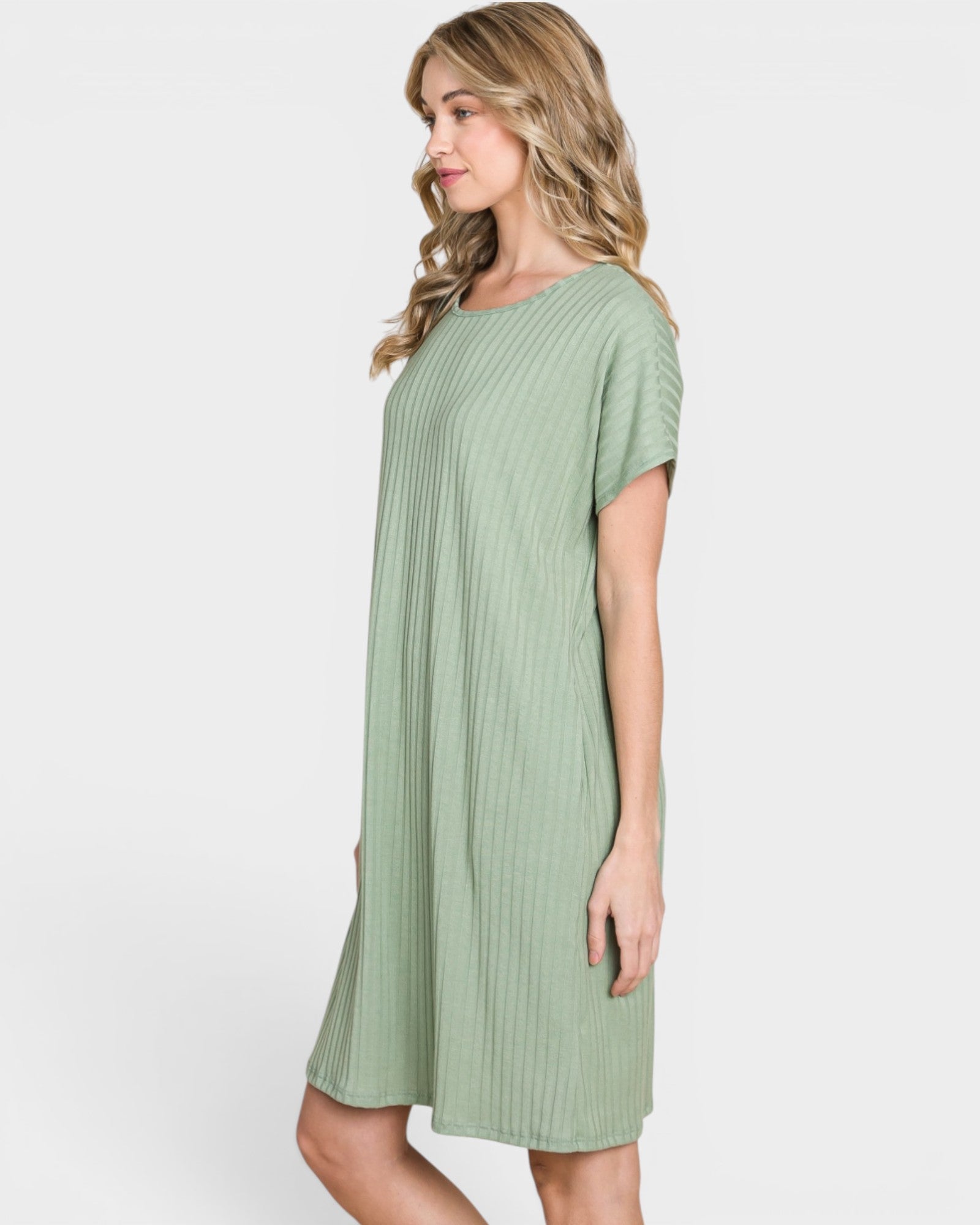 Woman wearing a green dress on a white background