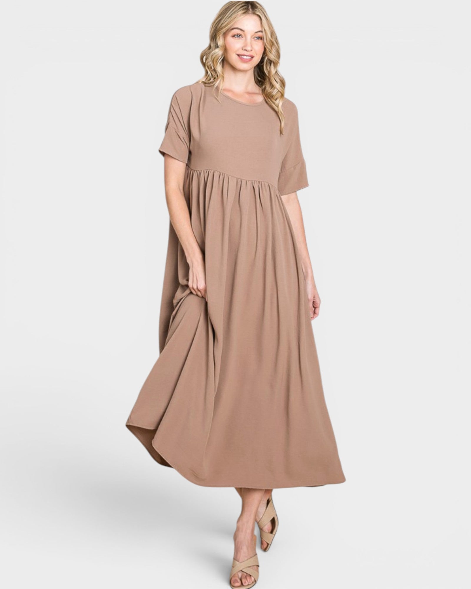 Woman wearing a brown dress on a white background