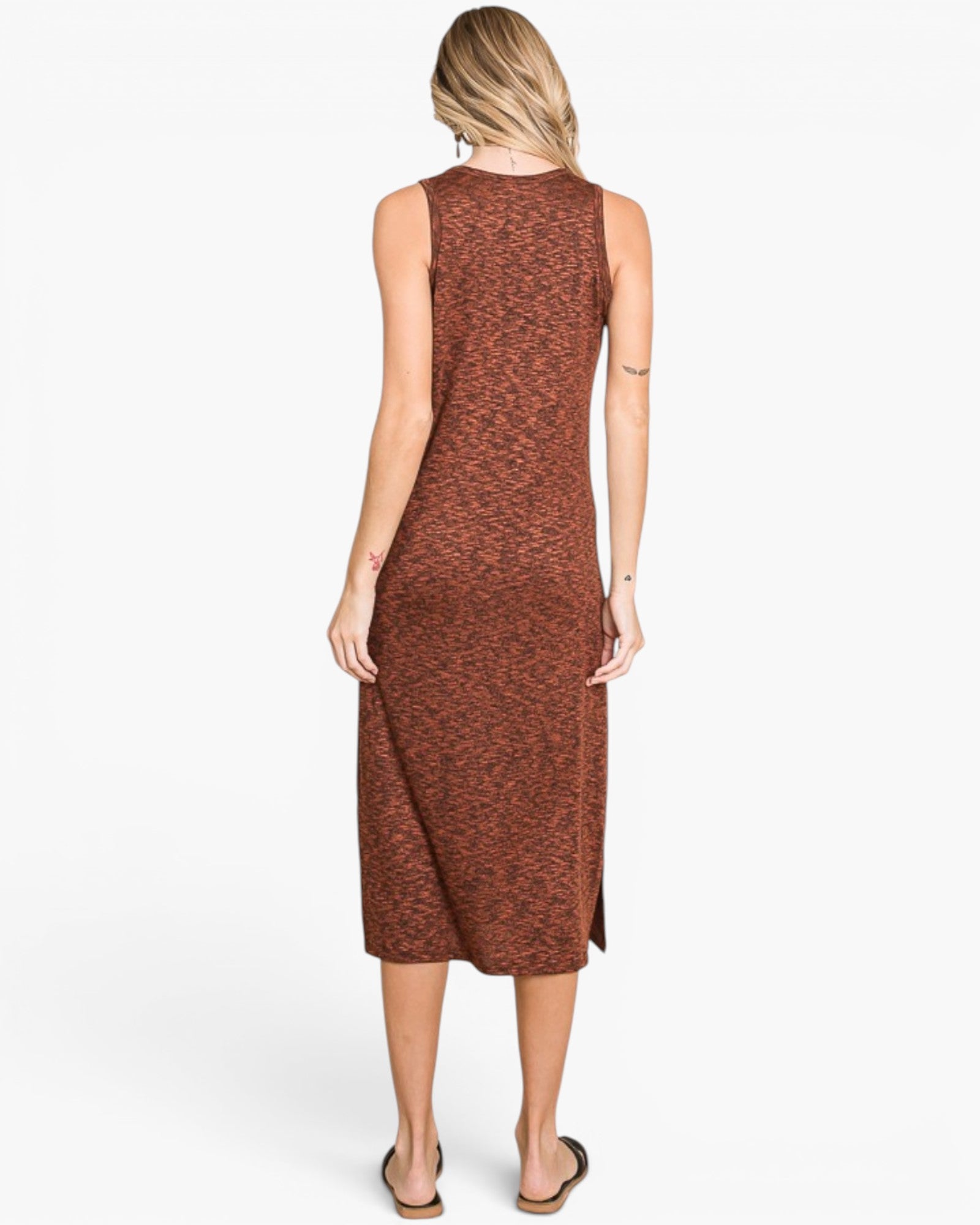 A woman viewed from the back wearing a sleeveless, knee-length rust-brown dress with a subtle heathered texture, set against a plain white studio background.