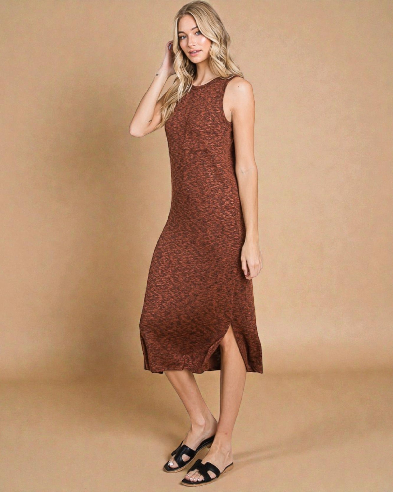 Woman wearing a brown sleeveless dress against a beige background