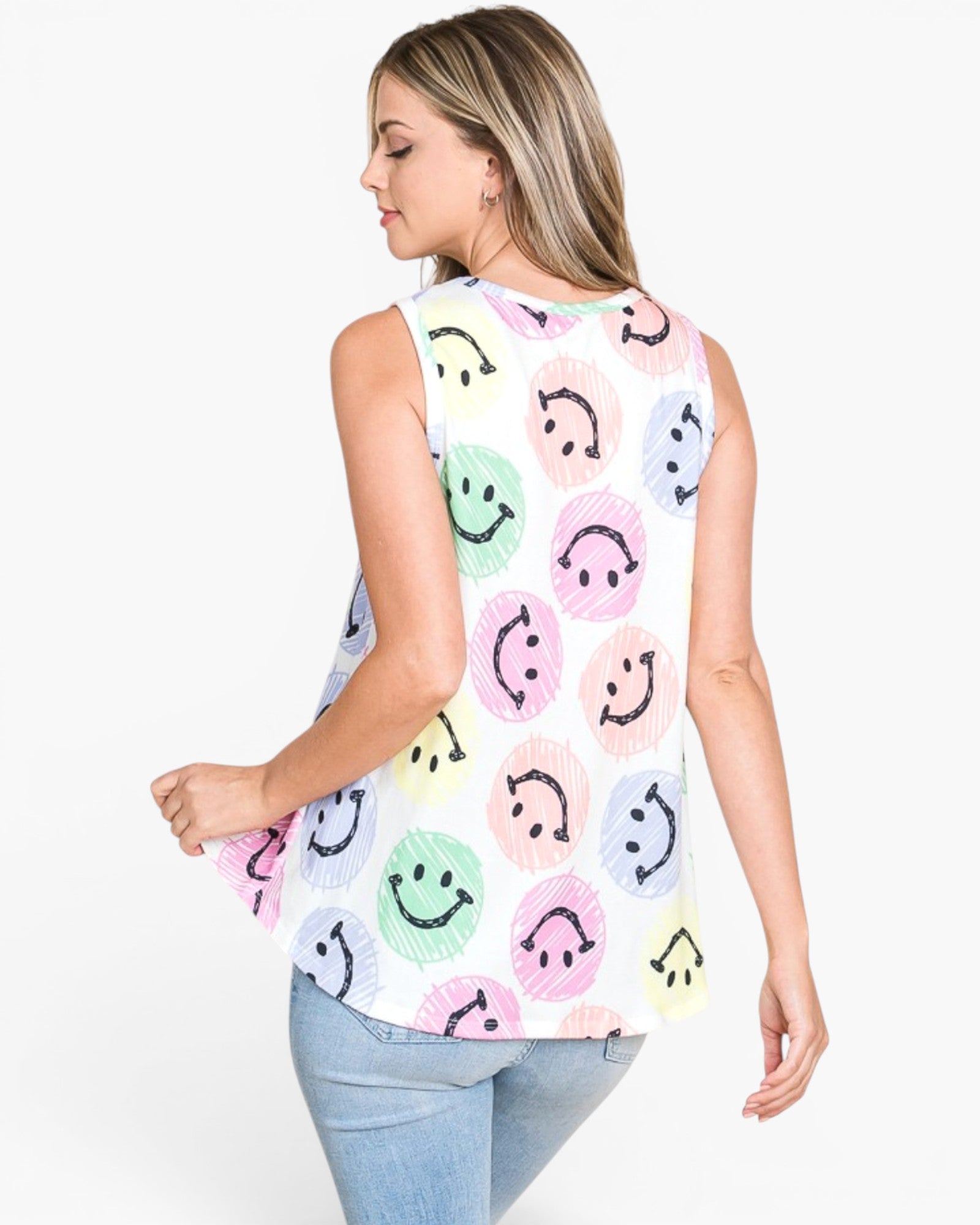 A woman shown from the back wearing a sleeveless white top with a colorful smiley face pattern, paired with light blue jeans, against a plain white background.