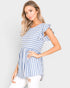 Woman wearing a blue and white striped dress against a plain background